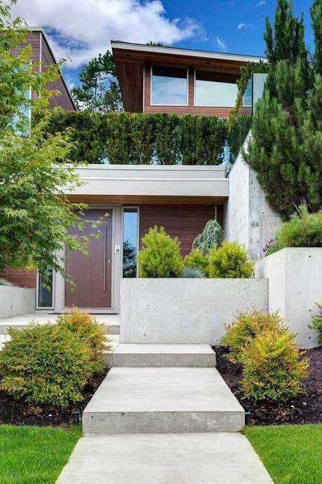 19. Fachada de casa moderna com jardim residencial – Foto: Pinterest 19. Fachada de casa moderna com jardim residencial – Foto: Pinterest