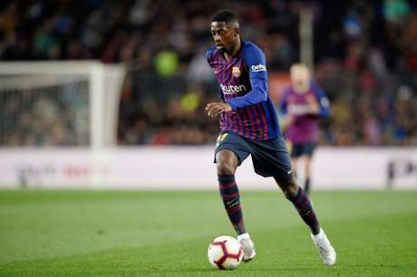 Dembélé está tratando lesão para voltar a jogar nesta temporada (Foto: AFP) Dembélé está tratando lesão para voltar a jogar nesta temporada (Foto: AFP)
