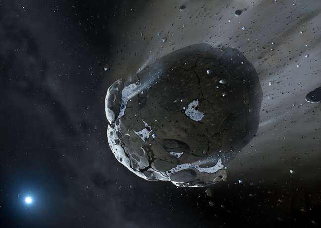 <p>Impressão artística mostra asteroide rico em pedras e água sendo despedaçado pela forte gravidade da estrela anã branca GD 61: essa é a primeira vez que água é encontrada além do Sistema Solar</p>