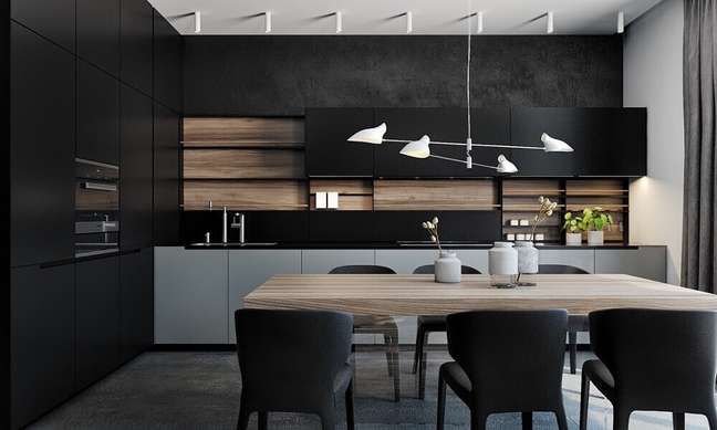 5. Cozinha planejada preta com luminária de teto bem moderna