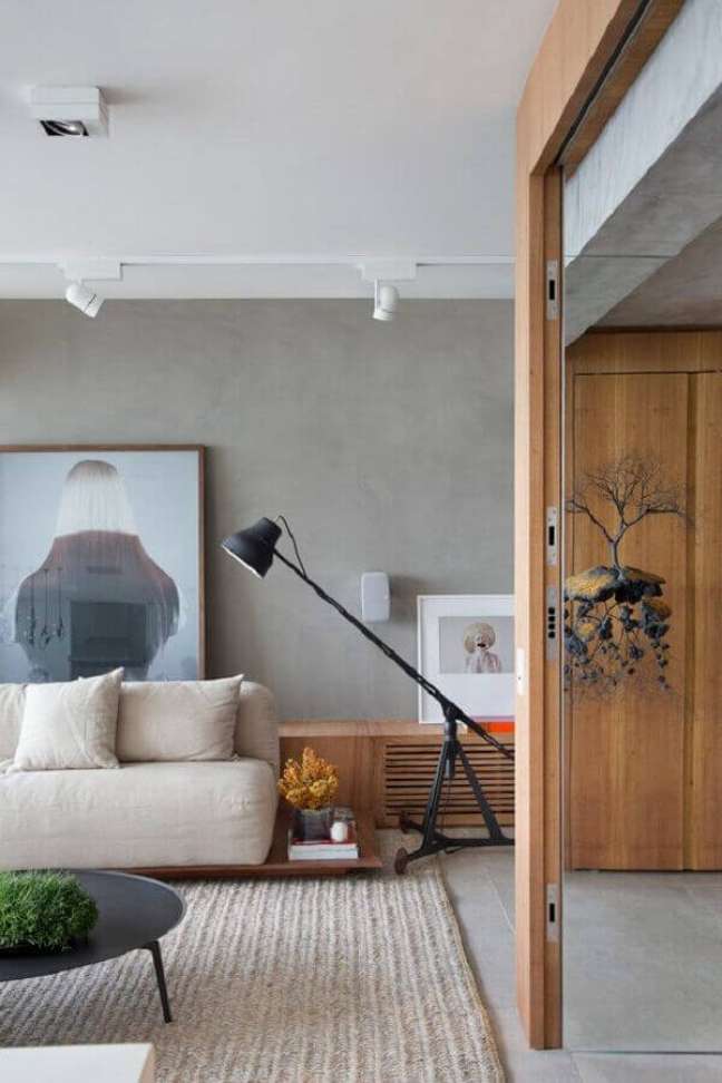 23. Luminária de chão moderna para sala de estar decorada com parede de cimento queimado – Foto Studio Roca