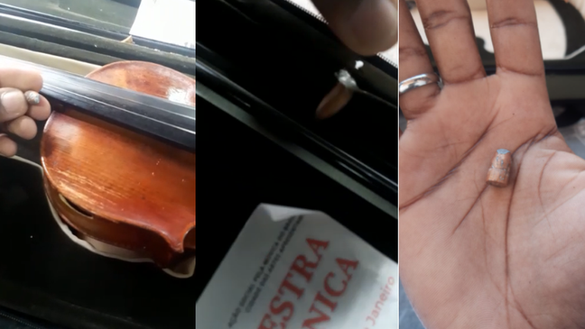 Jovem mostra bala que atingiu violino na manhã de 20 de agosto Jovem mostra bala que atingiu violino na manhã de 20 de agosto