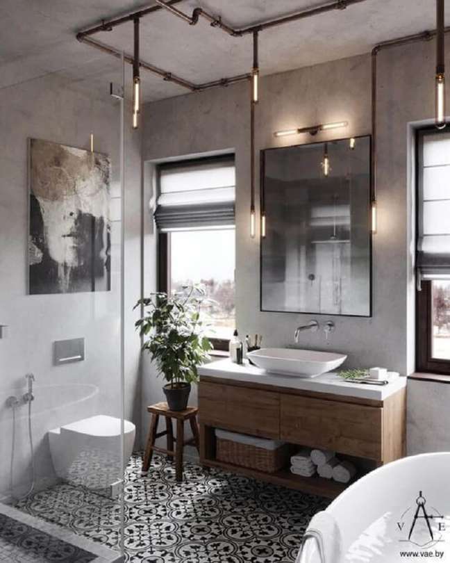 38. Gabinete de madeira para banheiro estilo industrial decorado com parede de cimento queimado – Foto: Home Designing