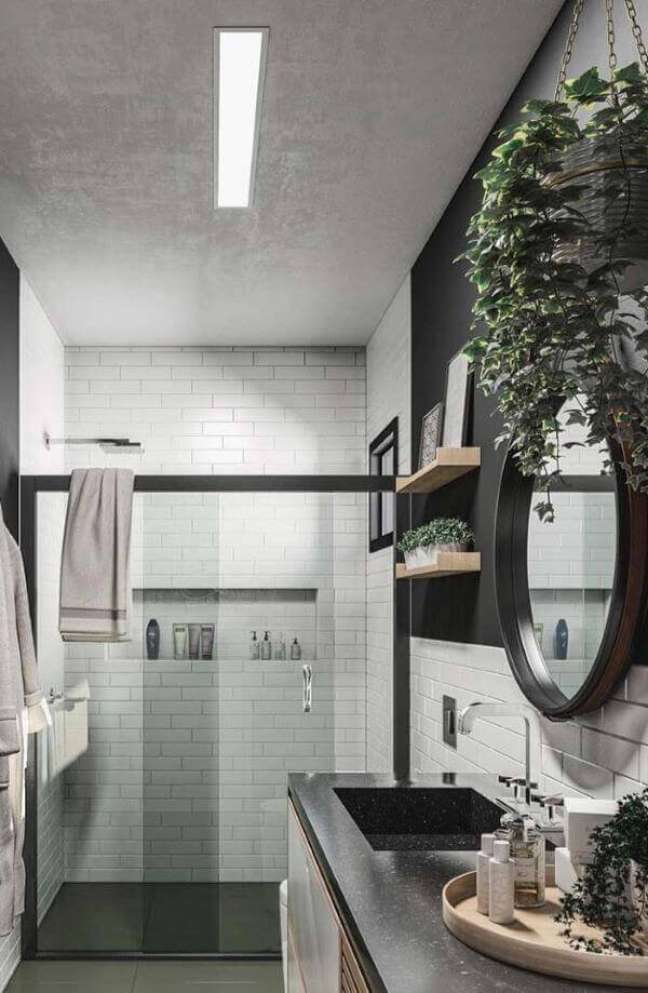24. Banheiro moderno com cuba esculpida de porcelanato preta – Foto Vitamine Interactive