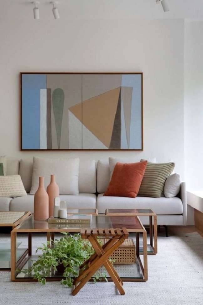 34. Decoração clean para sala de estar com quadro colorido – Foto: Escala Arquitetura