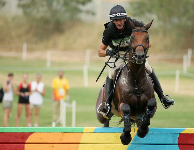 Two-time Olympic equestrian champion Mark Todd has been suspended for assaulting a horse during training