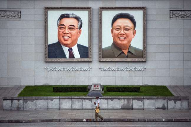 North Korea has a personality cult of its leaders.  Portraits like the one in the photo (of founder Kim Il-sung with his son and successor Kim Jong-il), as well as statues, are ubiquitous in the country.