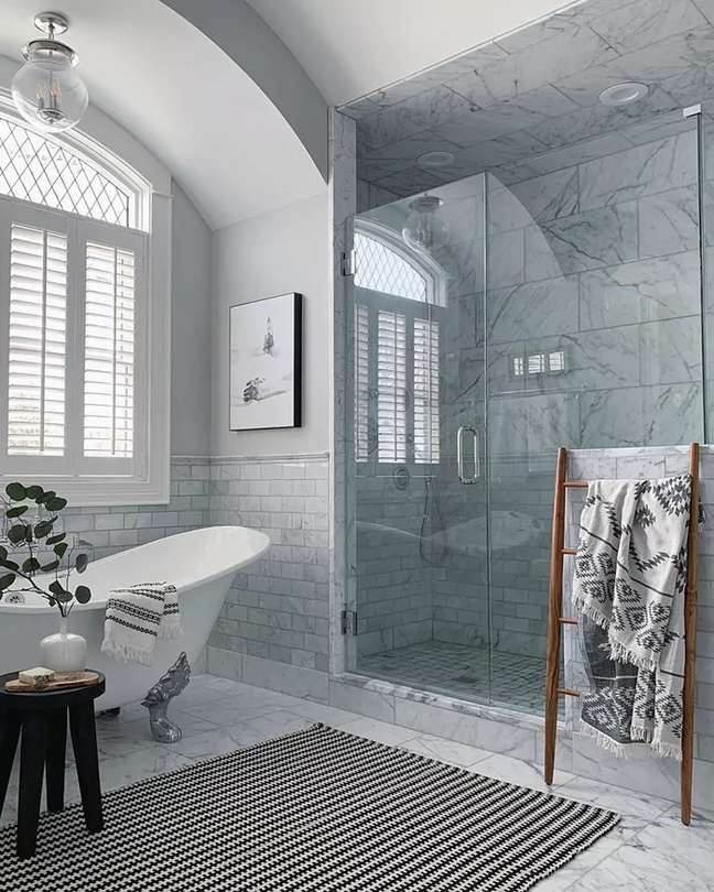 This stunning luxury remodel from lemonleafhomeinteriors features floor-to-ceiling tiles in various sizes, but all from the same color family.  The different sizes help add dynamics, while the color scheme lends the look cohesive and classic.  If you want a spa-like bathroom but don't want it to be too monotonous, change the tile size.