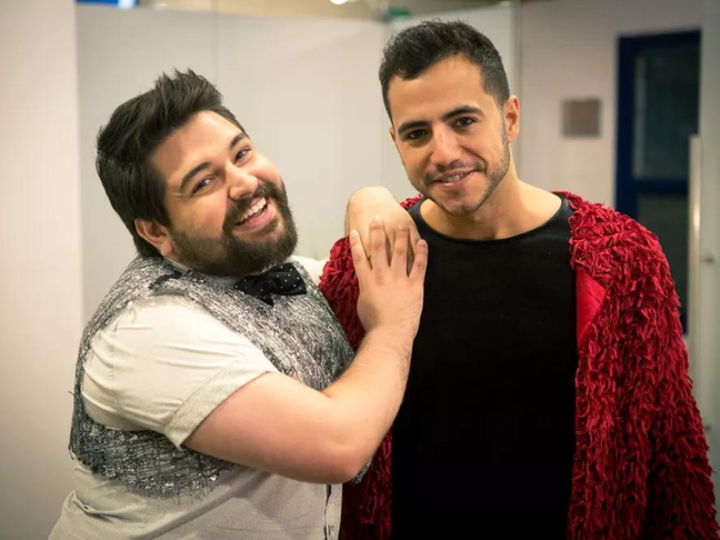 Matheus Lisboa poses with Leo Bahia behind the scenes of 