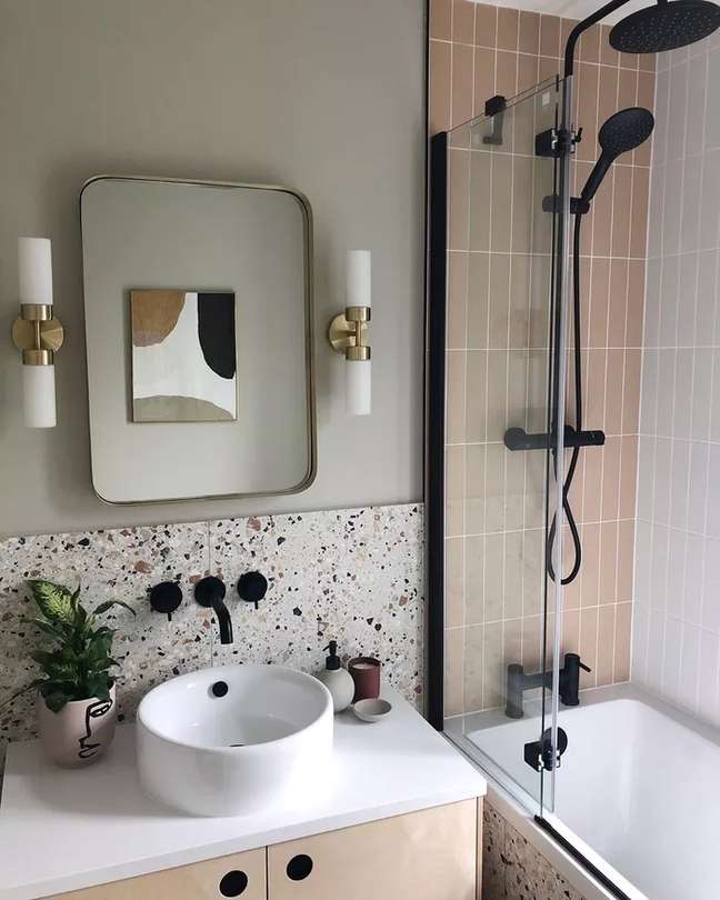 This bathroom by formandbalance features a salmon-colored subway tile that complements the beautiful terrazzo tile on the wall. The terrace is making a big comeback, it adds a lot of visual interest and is easy to clean because it camouflages stains. This bathroom by formandbalance features a salmon-colored subway tile that complements the beautiful terrazzo tile on the wall. The terrace is making a big comeback, it adds a lot of visual interest and is easy to clean because it camouflages stains.