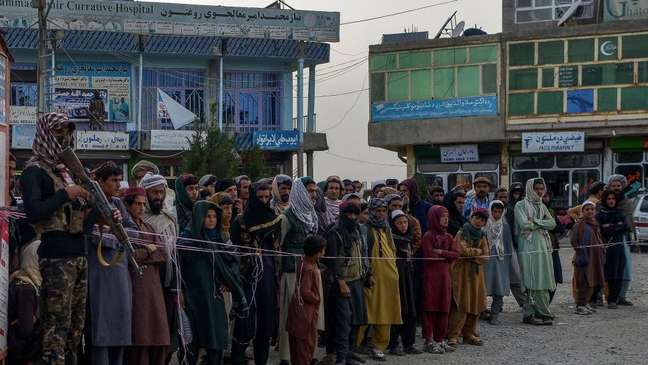 People in the city of Sharan, the capital of Paktika province, line up to donate blood to the victims of the earthquake.