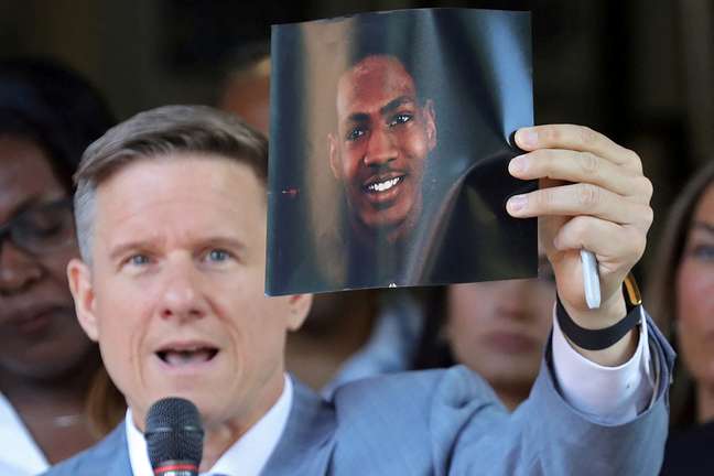 Lawyer Bobby DiCello holds up a photograph of Jayland Walker, the man who was shot to death by Akron Police