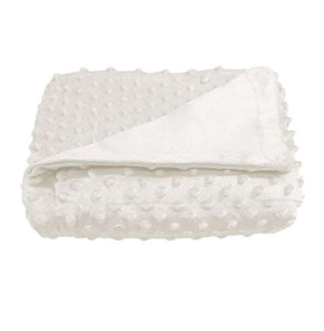 cobertor branco com textura de bolinhas dobrado