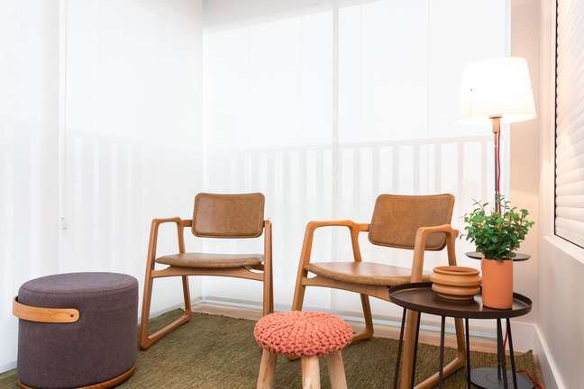 On the balcony, the classic model of the chairs creates a point of refuge and tranquility. On the balcony, the classic model of the chairs creates a point of refuge and tranquility.