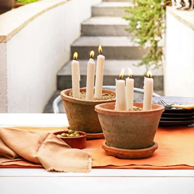 Make a candlestick with vases.