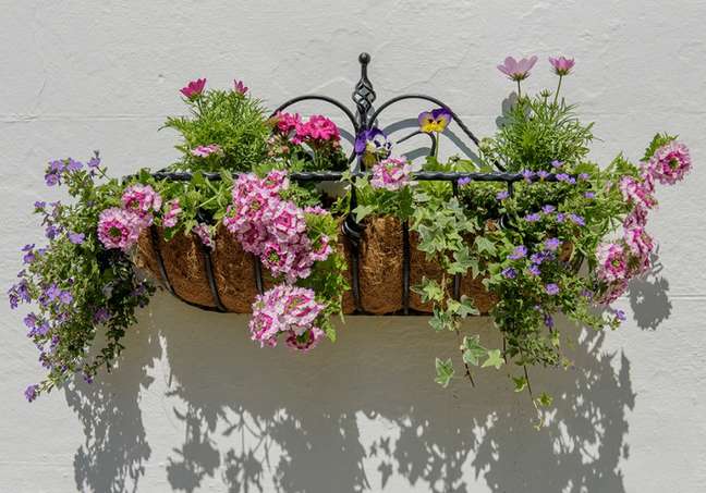 Hang baskets full of flowers.