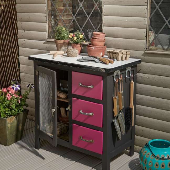 Turn an old cupboard into a table with vases.