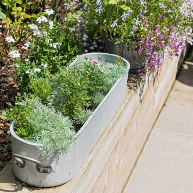 Reuse old pots as planters.