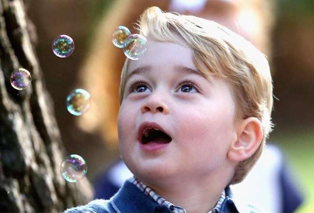 Prince George gazes at the soap bubbles Prince George gazes at the soap bubbles