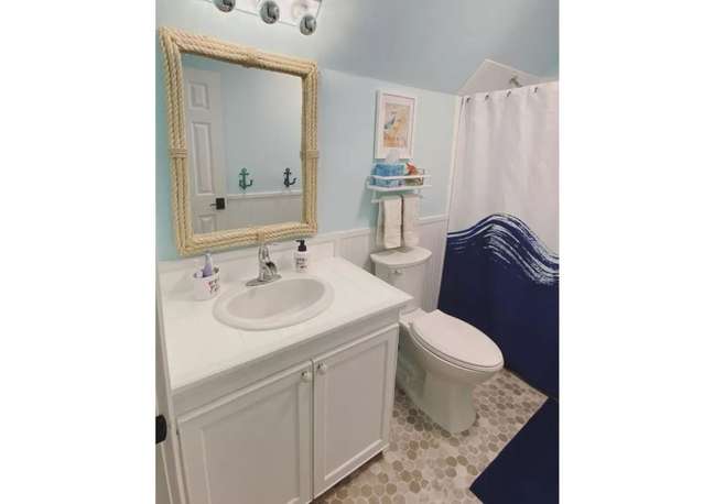 Rope decorated accessories are also essential in any beach bath. This nautical mirror is both functional and fun. Rope decorated accessories are also essential in any beach bathroom. This nautical mirror is both functional and fun.
