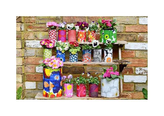 Marimekko style decorative tin planters. Marimekko style decorative tin planters.