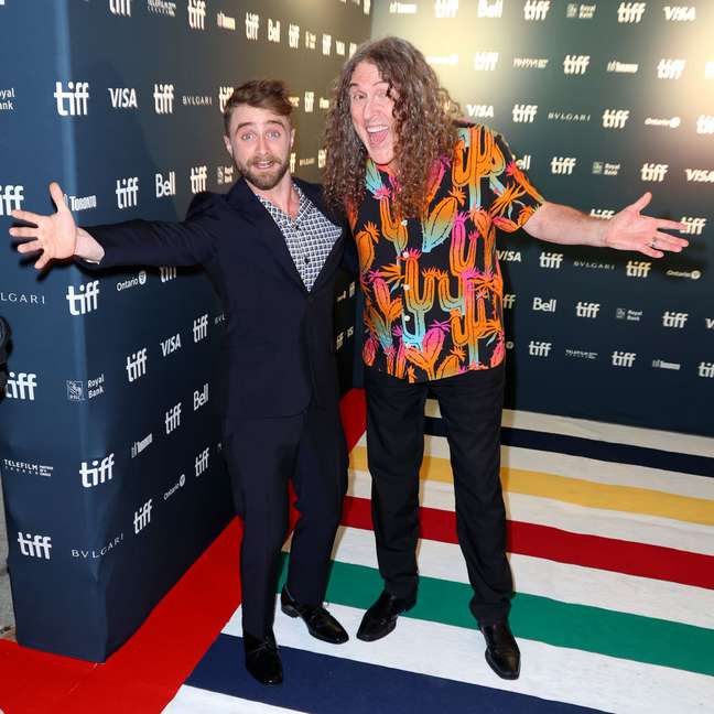 Daniel Radcliffe laughs at the premiere of “Weird” at the Toronto Film Festival
