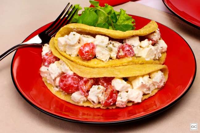 Functional crepioca stuffed with ricotta and tomato Functional crepioca stuffed with ricotta and tomato