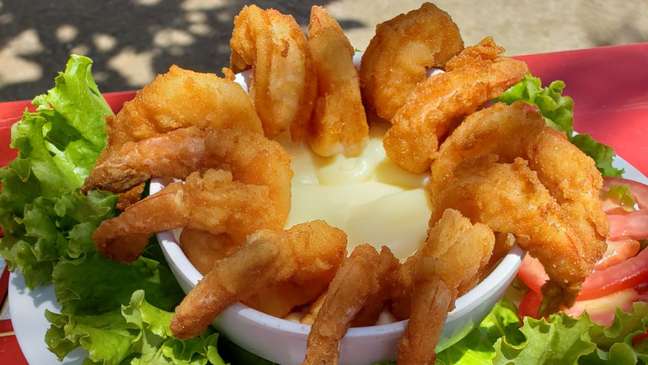 Breaded prawn appetizer with sweet and sour sauce to cheer for Brazil