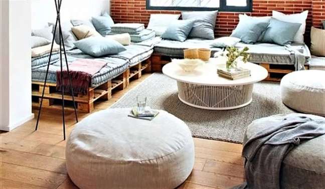 Sofa Base - Relax on this sofa with a safe glass of wine knowing you paid for it much less than if you bought it at a furniture store. That's because a double layer of wooden pallets forms its base, and its only expense is the mats and cushions on top. As a bonus, pallets provide two levels of storage for flat items. Sofa Base - Relax on this sofa with a safe glass of wine knowing you paid for it much less than if you bought it at a furniture store. That's because a double layer of wooden pallets forms its base, and its only expense is the mats and cushions on top. As a bonus, pallets provide two levels of storage for flat items.