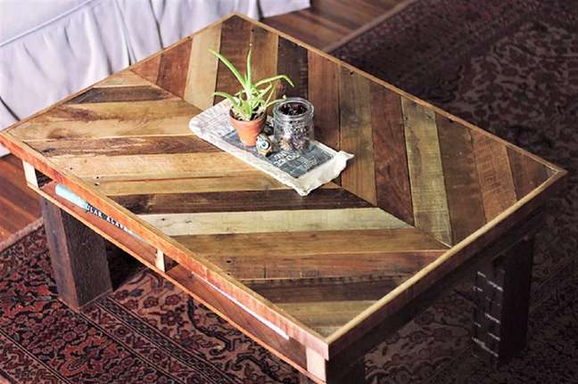 Chevron Center Table - Chevron patterned wooden planks added visual interest to this DIY coffee table by craftsmen Caitlin and Manda of The Merry Thought. All pallet boards are glued and nailed directly to a plywood base for structural support. Chevron Center Table - Chevron patterned wooden planks added visual interest to this DIY coffee table by craftsmen Caitlin and Manda of The Merry Thought. All pallet boards are glued and nailed directly to a plywood base for structural support.