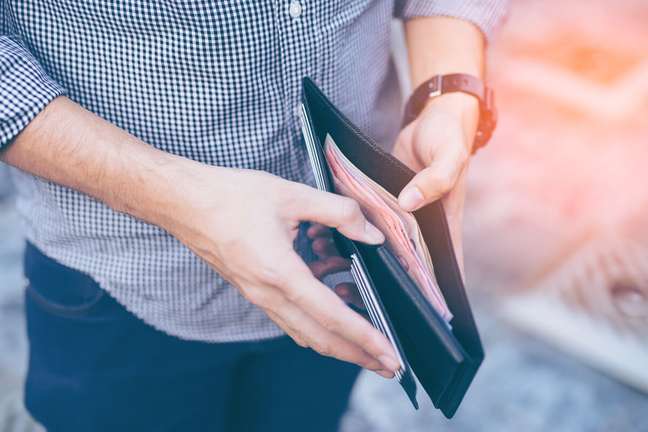 Saving money in your shoe attracts money for the new year Saving money in your shoe attracts money for the new year