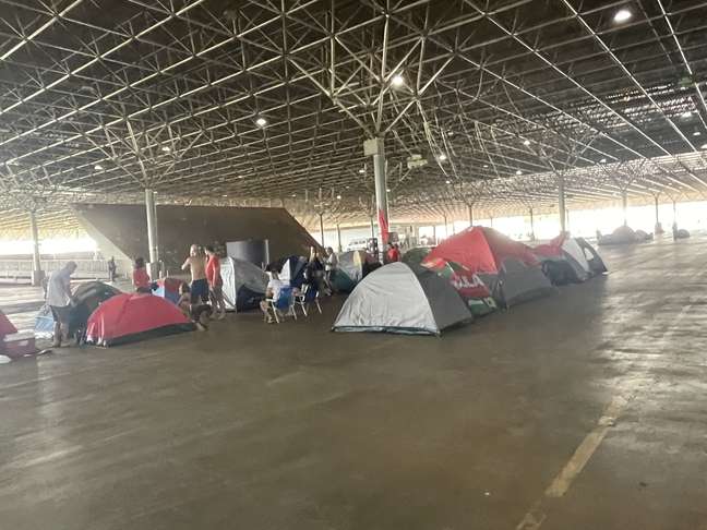 Tents in the city park;  The site still has plenty of room for camping. 