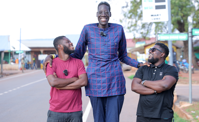 Awuche is nearly 2 feet (60cm) taller than BBC reporter Favor Nunoo (right) Awuche is nearly 2 feet (60cm) taller than BBC reporter Favor Nunoo (right)
