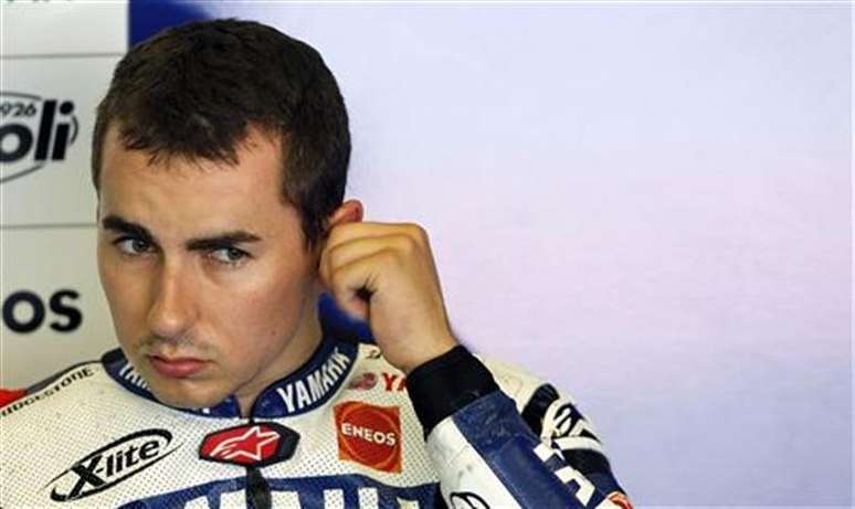 Yamaha MotoGP rider Jorge Lorenzo of Spain adjusts his earplugs inside the box during a training session at Circuit de Catalunya, in Montmelo, near Barcelona, June 4, 2012.