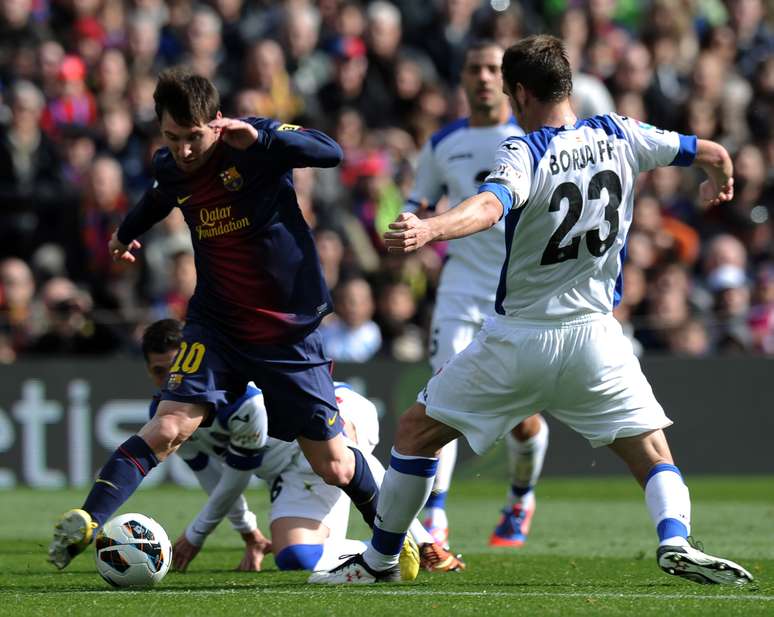 <p>Liderado por Messi , Barcelona goleou o Getafe com grande facilidade no Camp Nou</p>