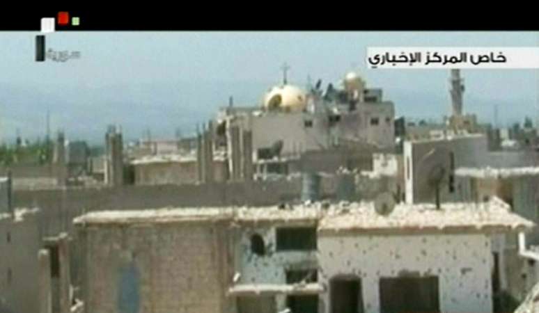 Imagem da TV síria mostra a destruição na cidade de Qusair