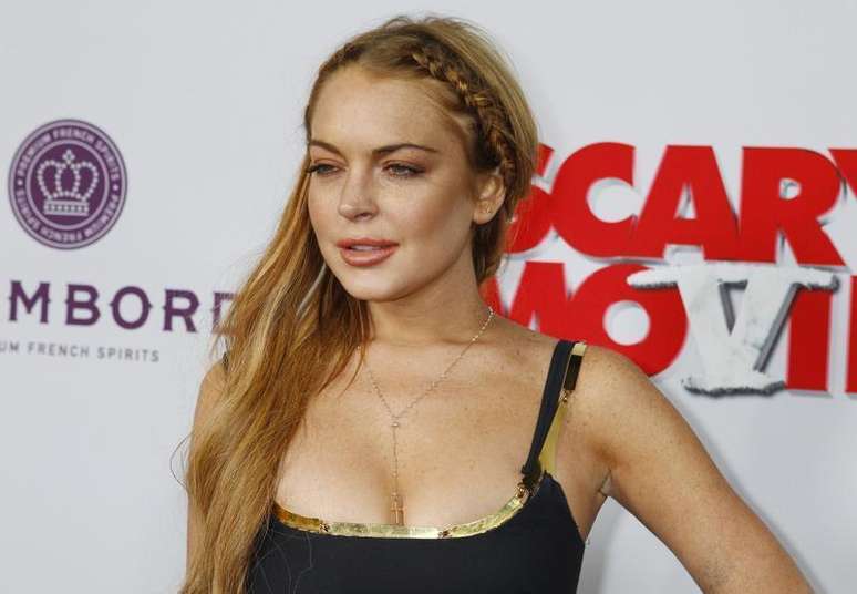 Atriz Lindsay Lohan ao chegar à estreia do filme "Todo Mundo em Pânico 5", em Hollywood. Semanas depois de concluir sua sexta passagem por uma clínica de reabilitação, Lohan declarou em entrevista exibida no domingo que é dependente e está convencida da necessidade de "calar a boca e escutar", porque sua antiga forma de lidar com problemas pessoais não funcionou. 11/04/2013.