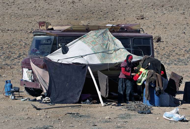 <p>Moradores de Yabroud, cidade dominada pelos rebeldes, buscam refúgio em Arsal, no Líbano</p>