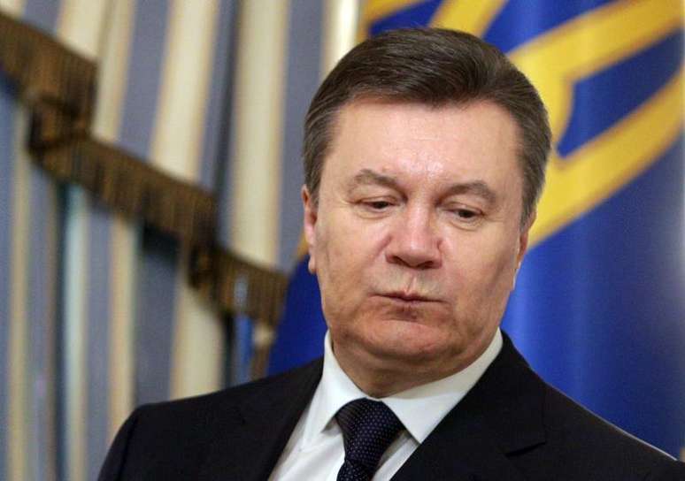 <p>Presidente deposto da Ucrânia, Viktor Yanukovich, durante cerimônia de assinatura de um acordo de paz com manifestantes, mediado pelo União Europeia, em Kiev</p>