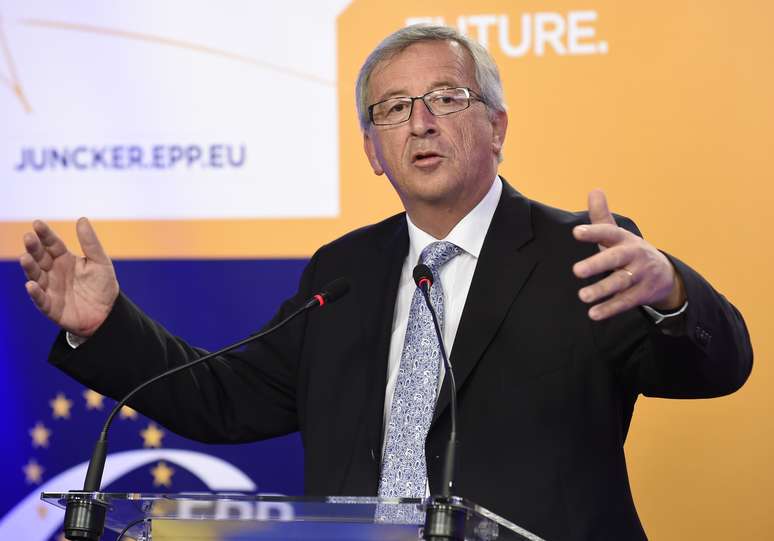 <p>Jean-Claude Juncker, candidato a presidente do Parlamento Europeu, pelo Partido Popular Europeu (PPE),  de centro-direita, discursa após os primeiros resultados das eleições europeias, neste domingo, 25 de maio</p>