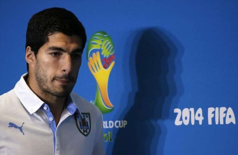Uruguay's national soccer team player Luis Suarez arrives at a news conference prior a training session at the Dunas Arena soccer stadium in Natal, June 23, 2014.