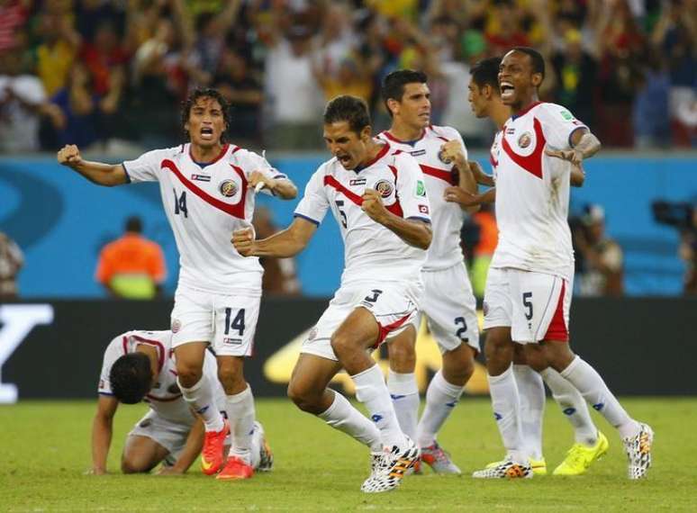 Costa Rica's players celebrate winning their 2014 World Cup round of 16 game against Greece at the Pernambuco arena in Recife June 29, 2014.