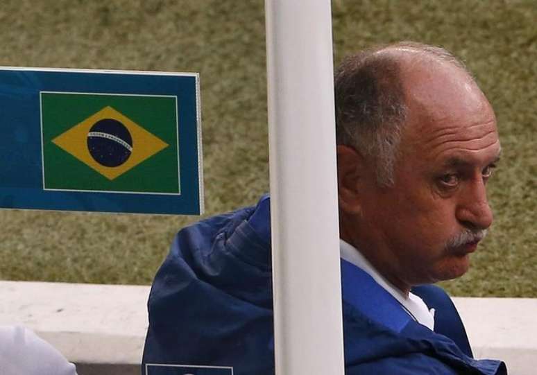 Brazil's coach Luiz Felipe Scolari gestures the number seven to his team during their 2014 World Cup semi-finals against Germany at the Mineirao stadium in Belo Horizonte July 8, 2014.