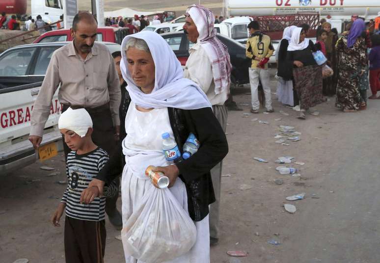 Cerca de 20 mil civis pertencentes à minoria yazidi conseguiram escapar do cerco dos jihadistas do Estado Islâmico (EI) em torno do monte Sinjar