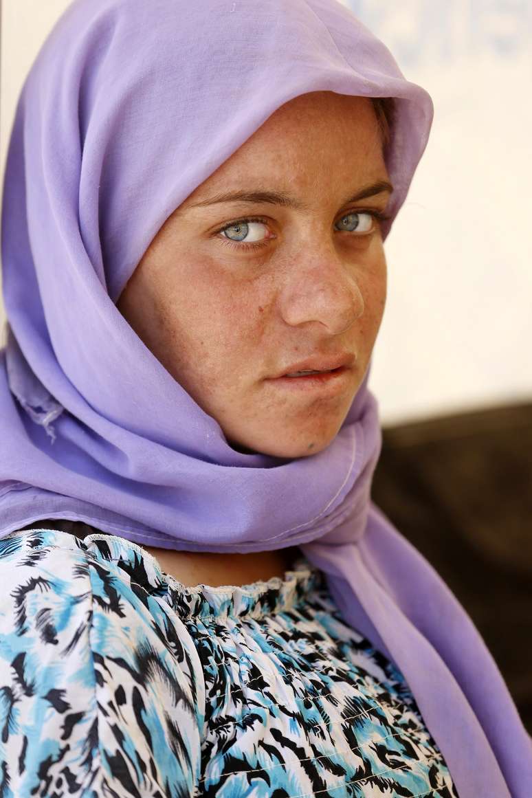 Refugiada yazidi é fotografada em Dohuk; dezenas de mulheres estão sendo escravizadas por jihadistas 
