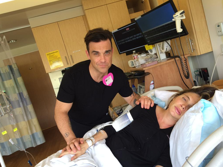 Robbie Williams com a mulher em trabalho de parto