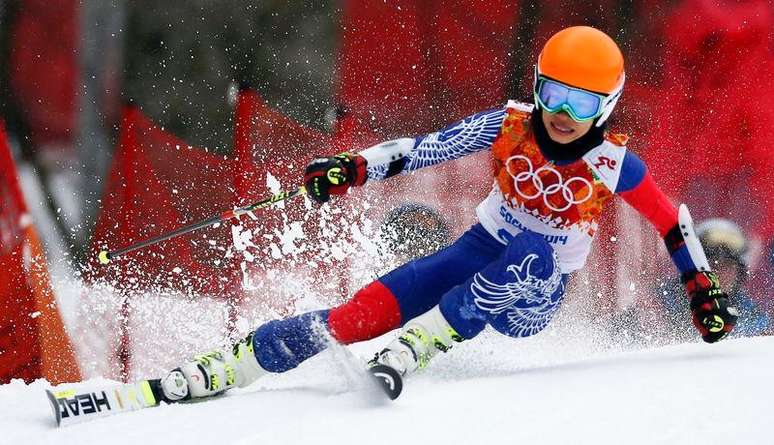 Vanessa Mae, competing for Thailand under her father's name Vanakorn, skis during the first run of the women's alpine skiing giant slalom event at the 2014 Sochi Winter Olympics at the Rosa Khutor Alpine Center, in this file picture taken February 18, 2014. Pop violinist Mae has been banned by the International Ski Federation (FIS) for four years over the manipulation of giant slalom races which allowed her to qualify for the Sochi Olympic Games.
