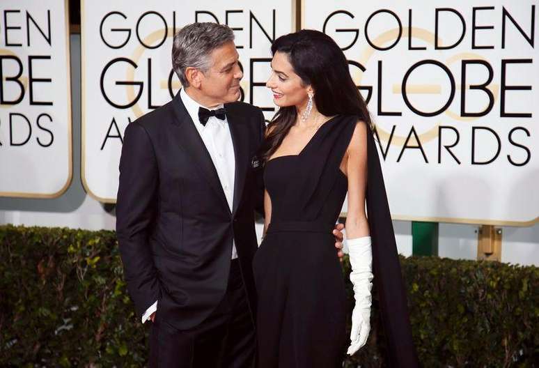 George e Amal Clooney no tapete vermelho do Globo do Ouro. 11/01/2015