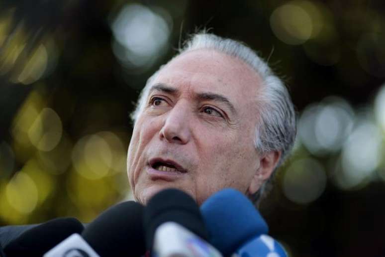 Brazil's Vice President Michel Temer speaks during a news conference in front of Alvorada Palace after a meeting with Brazil's President Dilma Rousseff in Brasilia October 28, 2014.