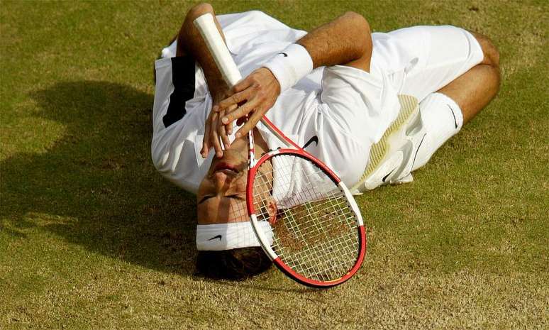 Vencedores em Wimbledon,  Roger Federer 2004  AFP PHOTO/CARL DE SOUZA